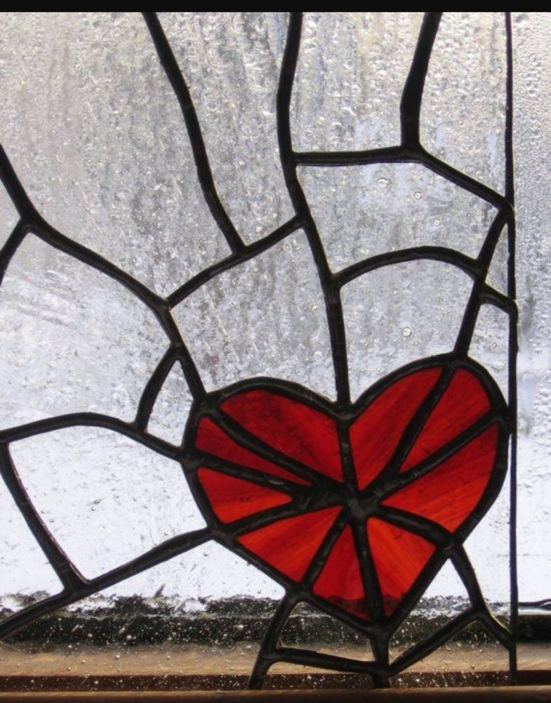 A red cracked stained glass heart