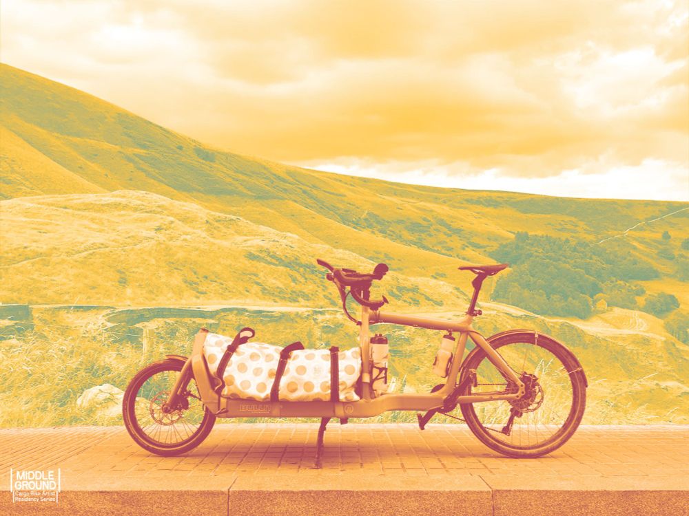 Middle Ground Project graphics. Bullitt cargo bike against the backdrop of a mountain.