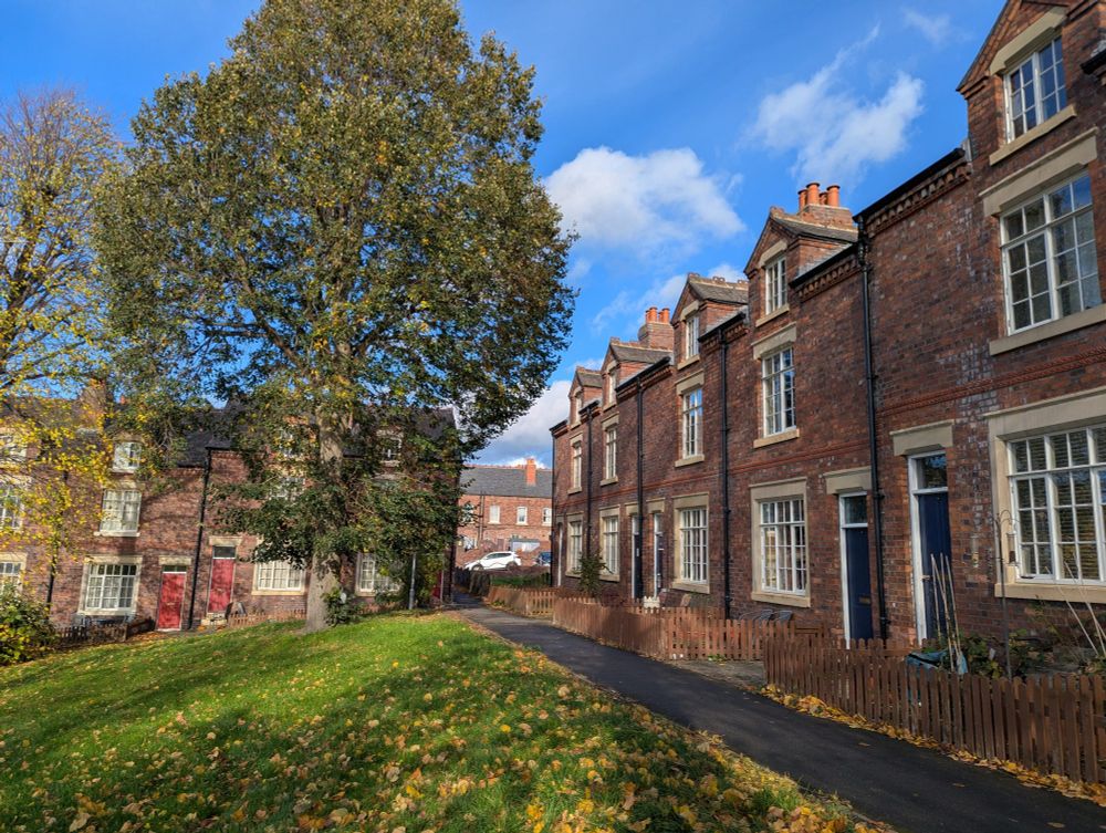 Three-storey terraces around 'village green'