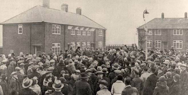 Chamberlain opening the 40,000th council home on Hopstone Road in the Weoley Castle Estate before a large crowd.