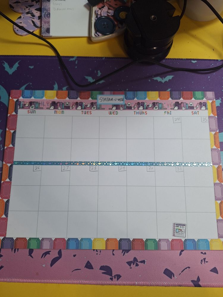 A calendar titled Stream-o-ween that is dated, but otherwise blank. It has been decorated with washi tape featuring books and ghosts.