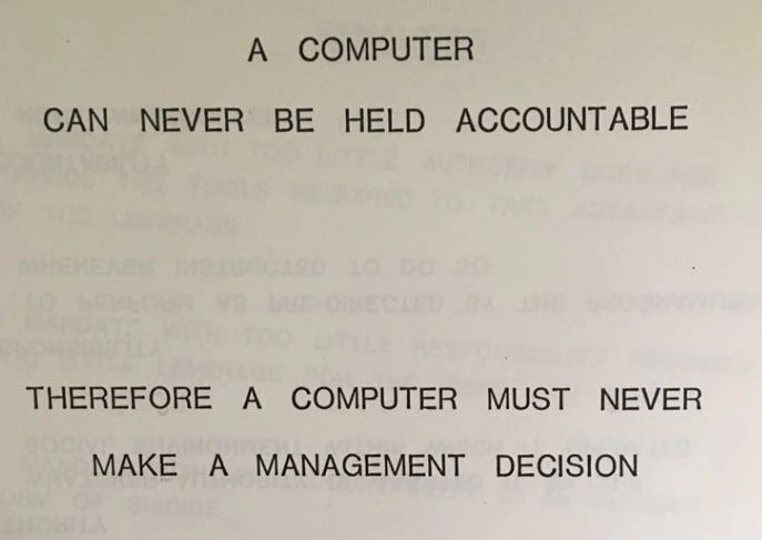 Part of a handbook which reads, a computer can never be held accountable therefore a computer must never make a management decision