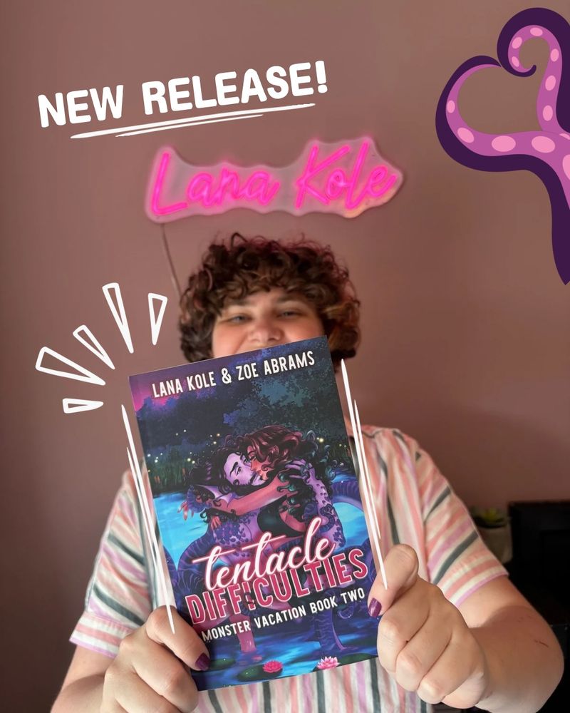 A very thrilled author celebrating their new book release by holding the book up to the lens and peering over the top excitedly. the graphic is emphasized with tentacles in the shape of a heart. 