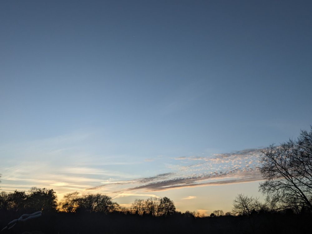 The evening sky with orange clouds on the horizon