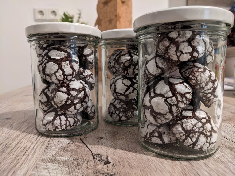 Chocolate crinkle cookies filled into jars