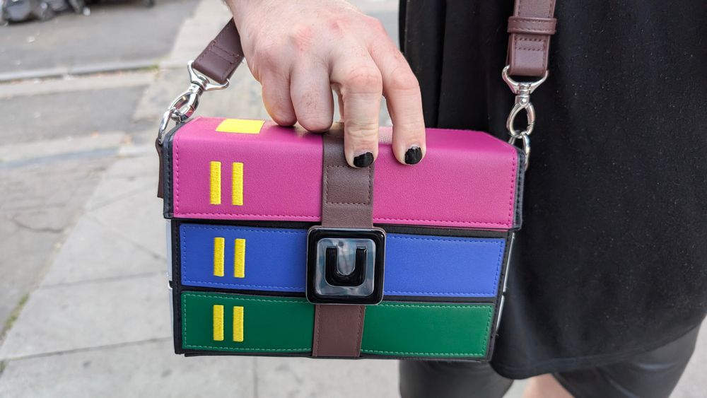 A photo of a purse made of leather of the winRar logo