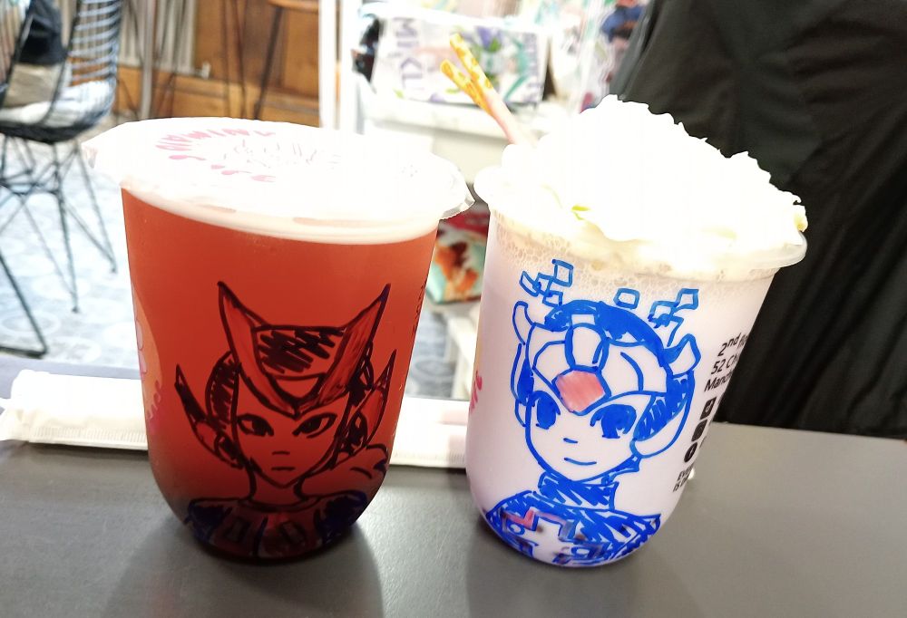 Boba with drawings of Zero and X on them