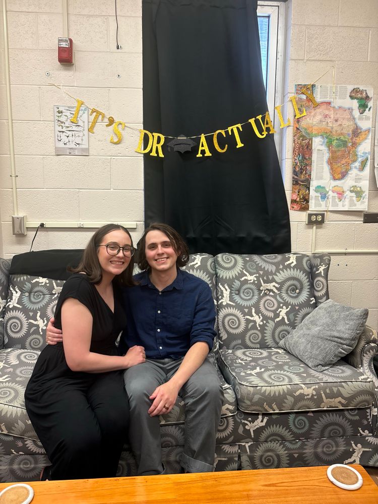 Xavier and Zoie smile on THE helicoprion couch 