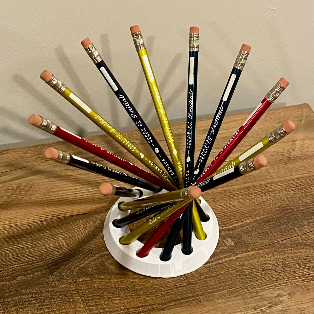 12 pencils arranged on a circular base to form a hyperboloid.