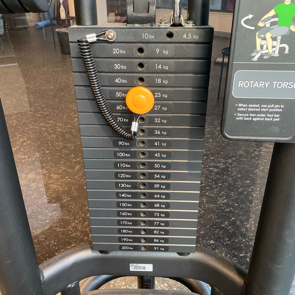 A stack of 10 lb weights on a gym machine.