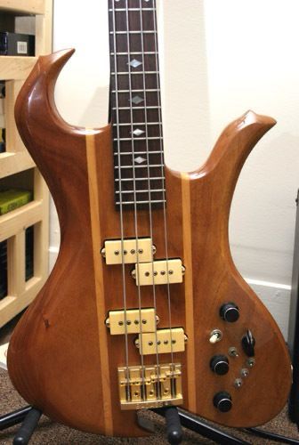 A BC Rich Wave bass in koa with double p pickups and the Moser circuit.