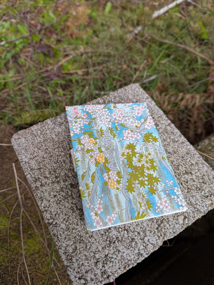 Hand bound journal on a stone