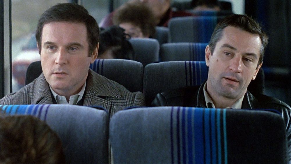 Grodin and De Niro in “Midnight Run,” sitting on a bus and clearly sick of each other
