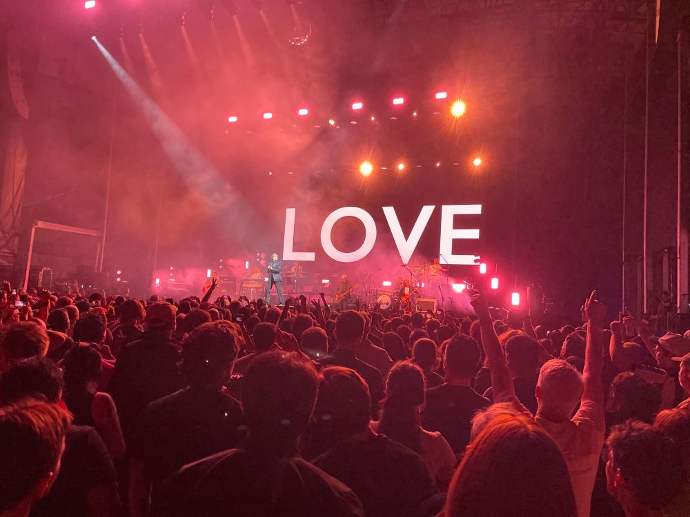 The word “Love” projected onto a scrim at the Pulp show at Forest Hills Stadium, September 11, 2025