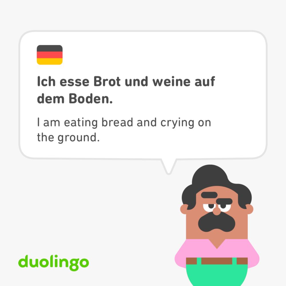 Duolingo German exercise with the phrase “I am eating bread and crying on the ground”
