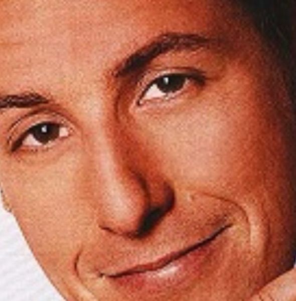 A closeup of Adam Sandler’s face from the poster for the 2006 film “Click”