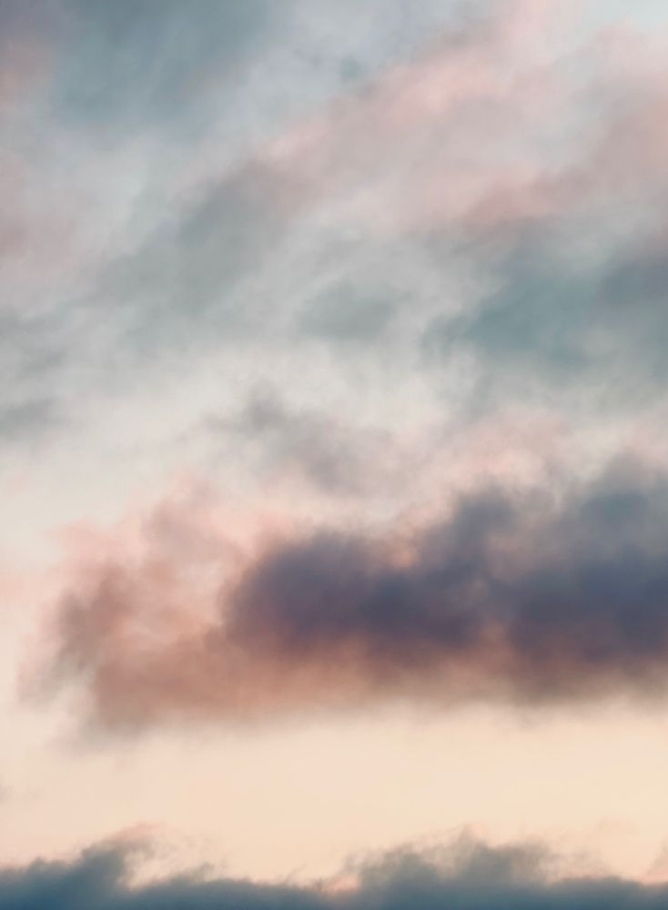 Gray and dark gray clouds and fog with hint of pink after sunset. Over San Francisco Bay.