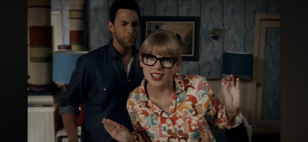 Taylor Swift in pajamas singing "we're never ever getting back together"