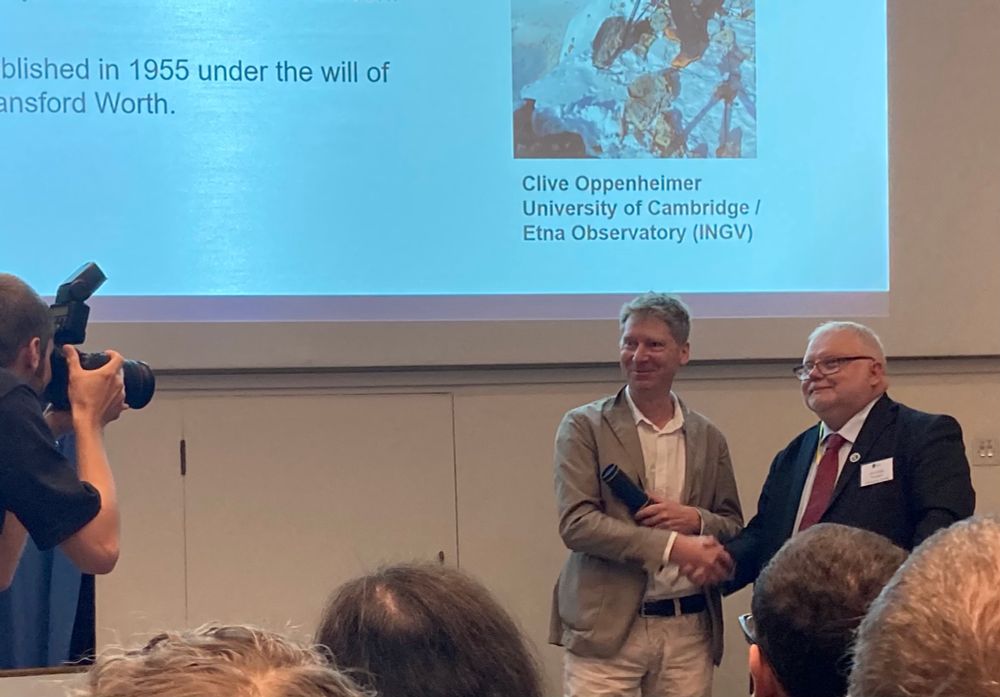 Photograph of Clive Oppenheimer, University of Cambridge, receiving the R H Worth Award from Geological Society President Jon Gluyas