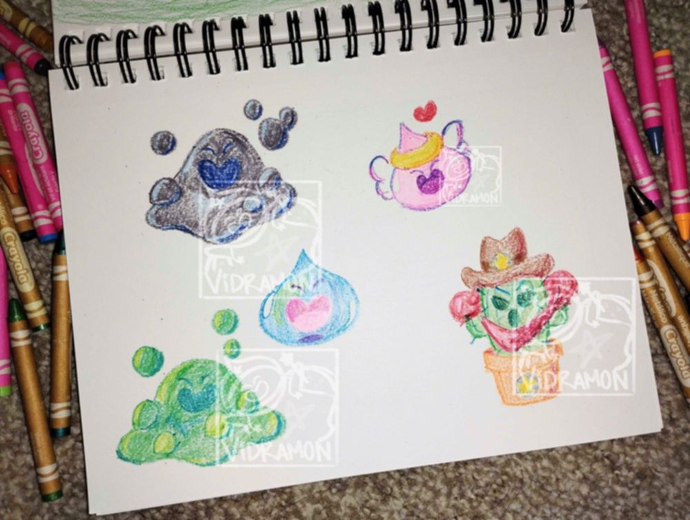Photo of a spiral sketchbook open to a page of colorful crayon doodles. The doodles are of a liquid metal slime, a regular slime, a bubble slime, an angel slime, and a potted sheriff Togemon. The  crayons used are visible in the photo, scattered around the sketchbook. 