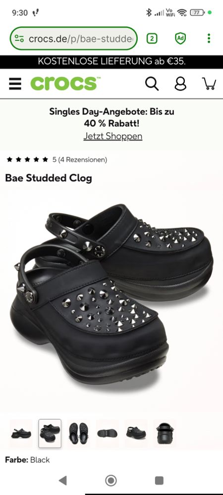 Schwarze Plateu-Crocs mit spitzen silbernen Nieten vorne und hinten. 