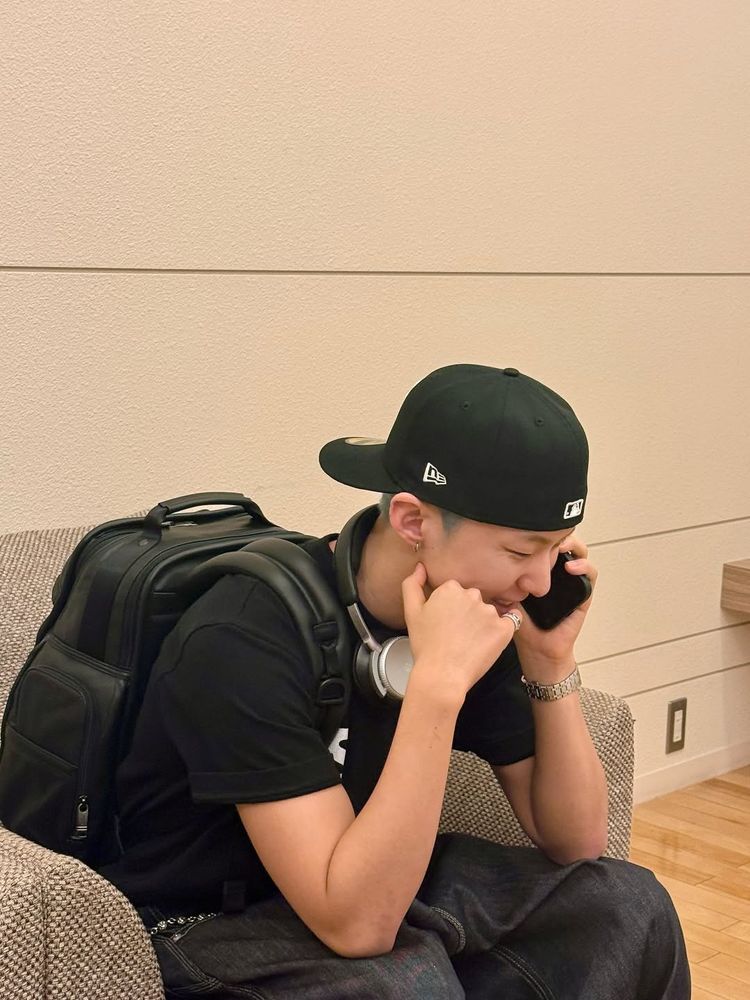 hoshi sitting in a chair and talking to someone on the phone