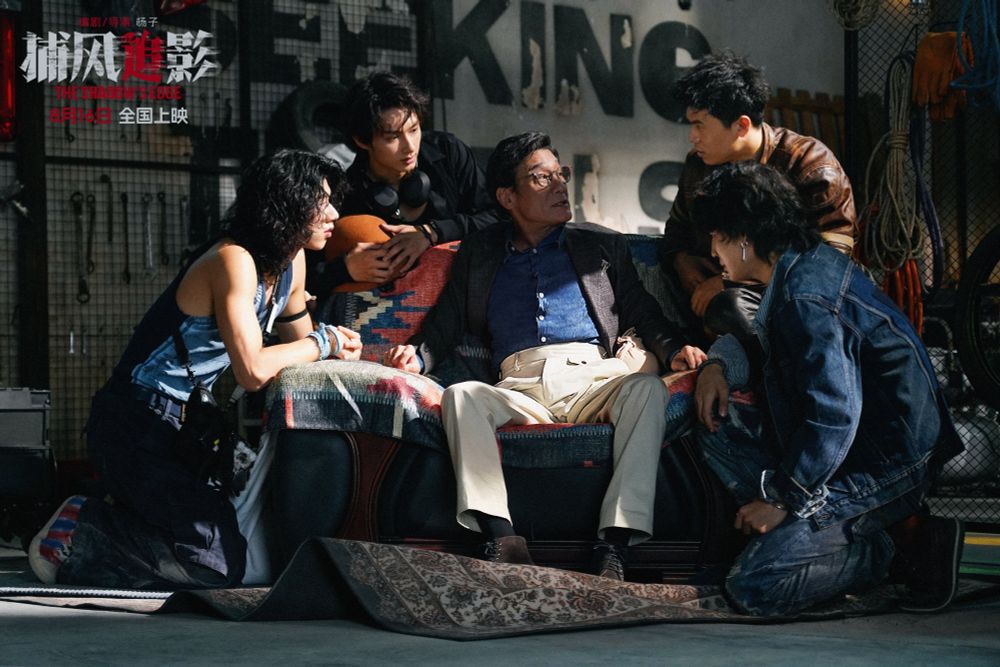 still photo of a group of people in 'the shadow's edge'