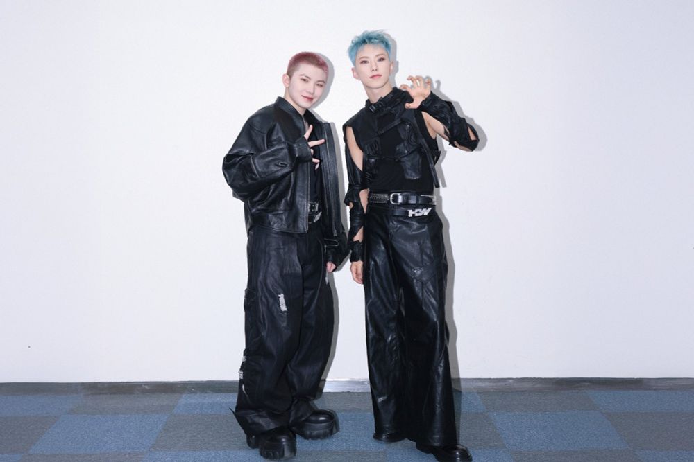 hoshi and woozi in their stage outfits for the 'warning' concert
