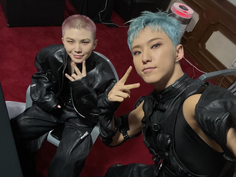 hoshi and woozi selfie doing peace signs in their 'warning' stage outfits