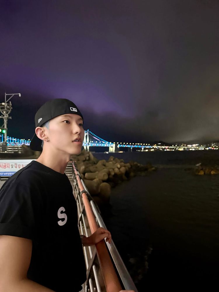 hoshi looking out over water at night