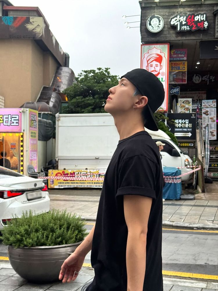 hoshi walking on a sidewalk and looking up