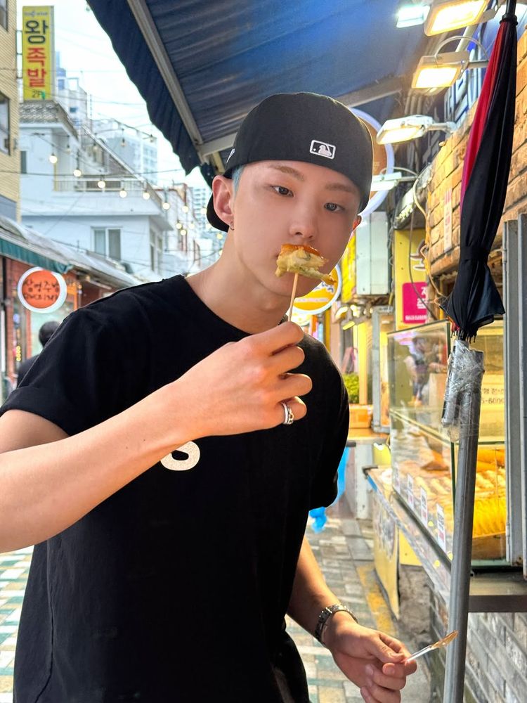 hoshi holding up a toothpick with a piece of food on it