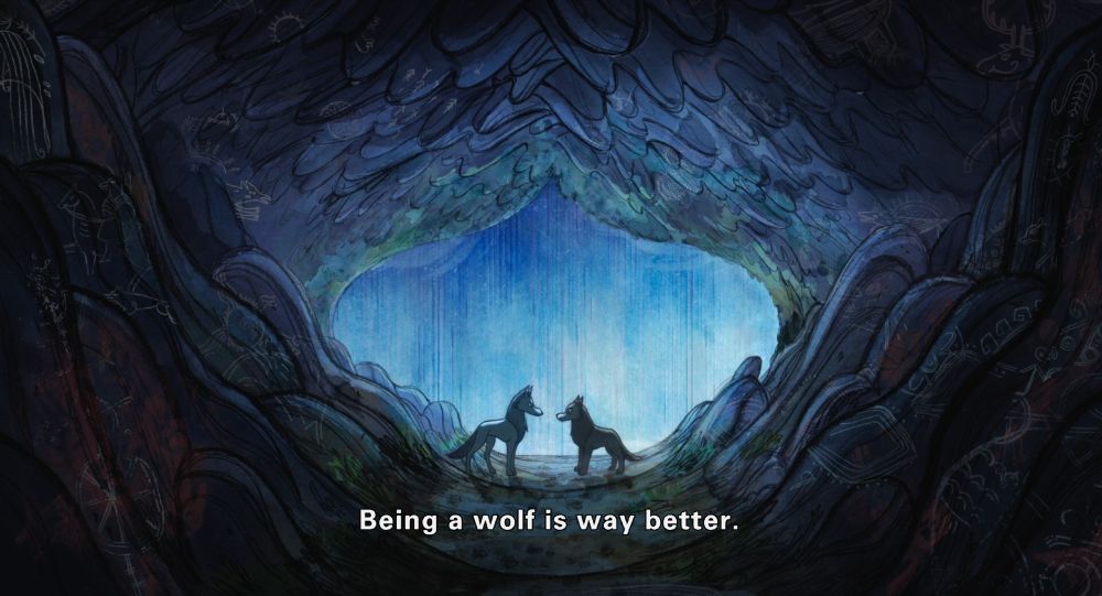 a screenshot from Wolfwalkers (2020) depicting an animated grey wolf and a brown wolf speaking to each other in the backlight of a moonlight-blue waterfall. the two wolves are facing each other directly. the image is surrounded on all sides by cave maw, rocky depictions lining the sides of the frame with various glowing drawings etched into them.

subtitle reads: "Being a wolf is way better."