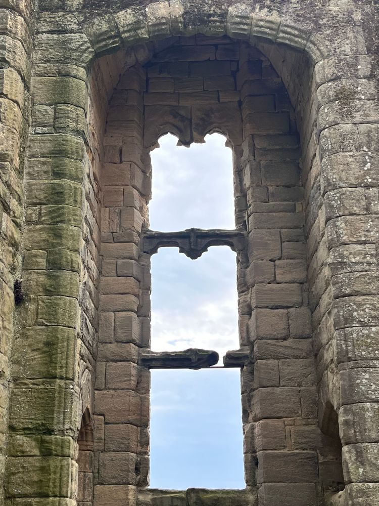 Summer sky though the ruined window