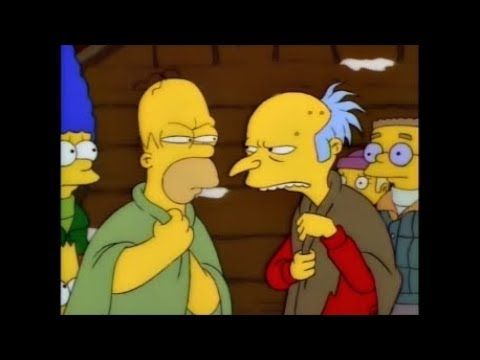Homer and Mr Burns glaring at each other.