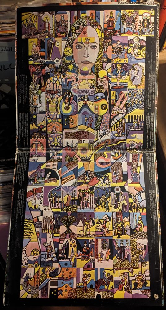 psychedelic gatefold art of naked woman made up of many smaller hand drawn images 