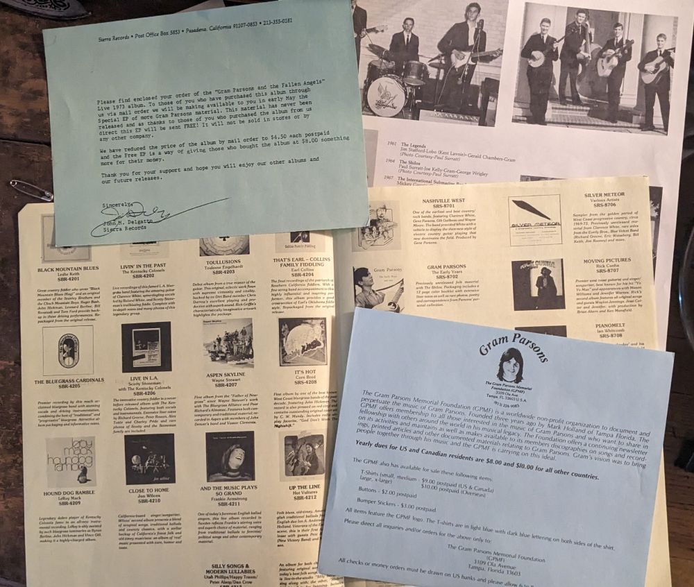 various pieces of paper packaged with LP