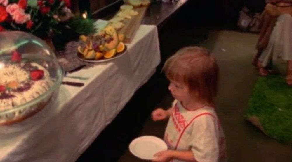 Sage Scully backstage at Winterland with paper plate and single grape