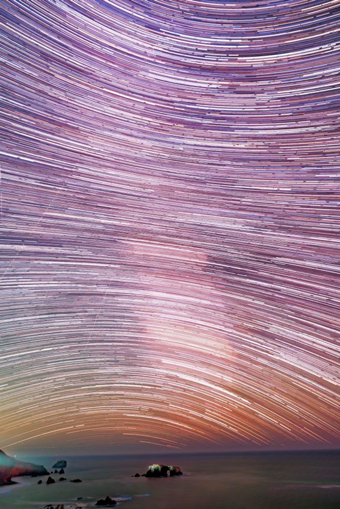 Star trails arching about Arch Rock Jenner California 