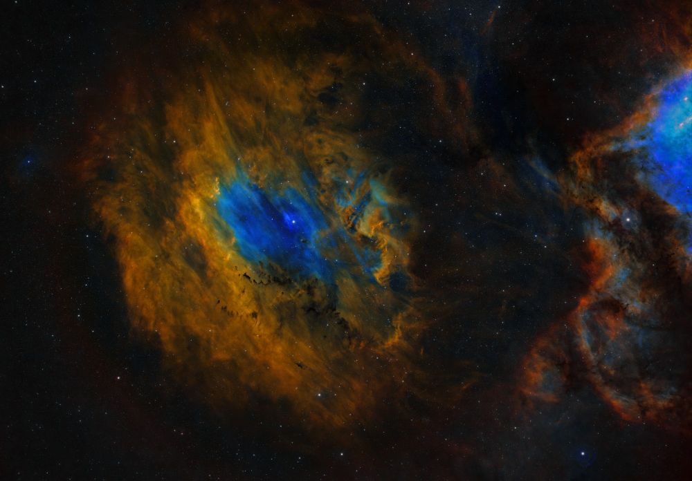 a narrowband image of SH2-119 the Flying Bat nebula in Cygnus just to the west of the well known North American Nebula and Pelican Nebula this image showcasing the elements of Sulfur, Oxygen, and Hydrogen, mapped to specific colors using the well know Hubble color pallet of SHO 