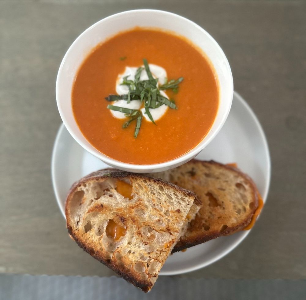 Smoky vegan tomato soup and grilled plant based cheese sandwich 