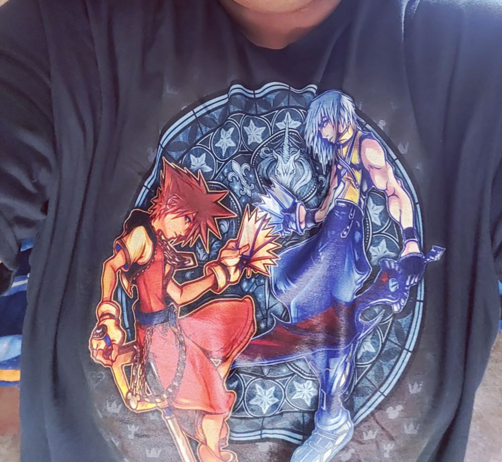Black, graphic T-shirt with Sora and Riku from Kingdom Hearts featured on it.
