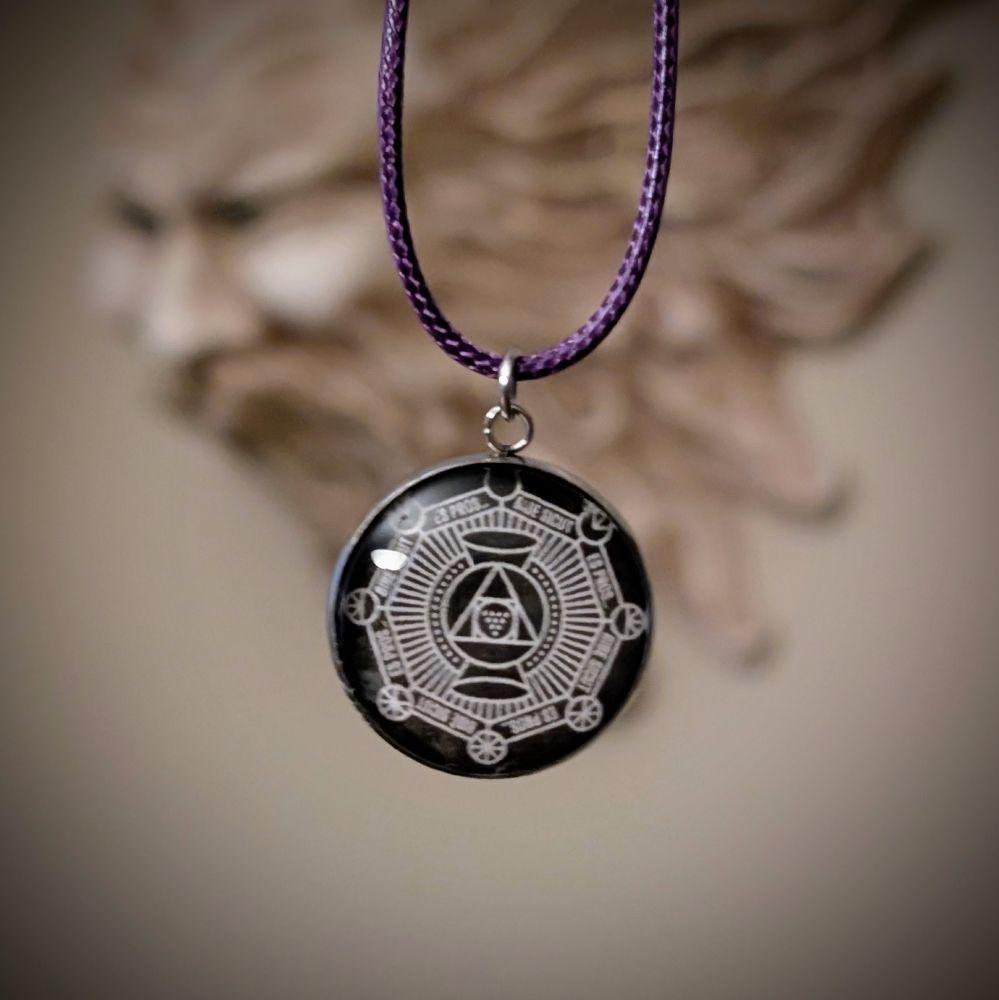 A glass medallion with cryptic iconography hanging from a very, very cheap necklace lanyard.

If you bothered to read the alt text, you have a leg up! These have a little bit of tech in them (I mean, we're Hackers, and Makers, and Whatnot), so you may want a smartphone or some other device to read them.

Yeah, we could have put some douchy stuff in them, but we're not that kind of assholes. If you're lucky enough to score one, we intentionally made them reprogrammable, so you can do cool things with them.