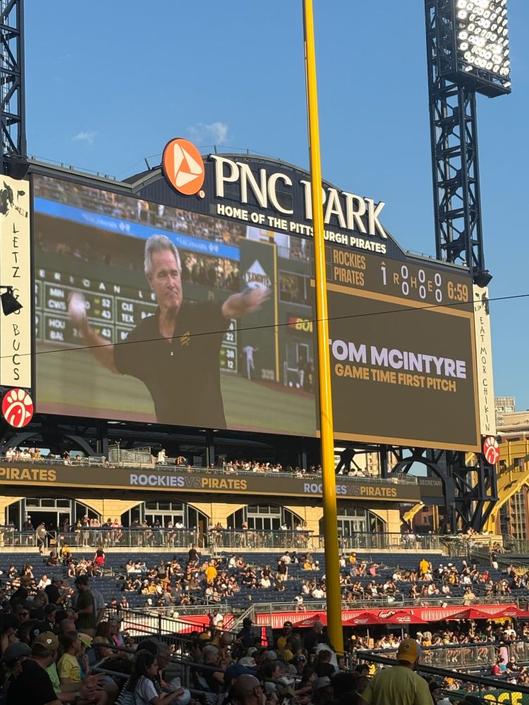 Scoreboard at PNC Park showing Tom McIntyre throwing out the first pitch before a Pirates game