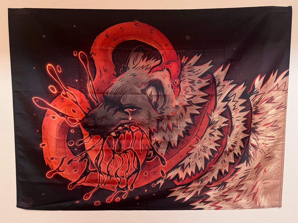 a black flag with two central figures in the center covering most of the space depicting a struggle between a hyena biting down on a snake while the snake strangles the hyena, a tear comes from the hyena’s eye and the snake appears dead with eyes crossed out