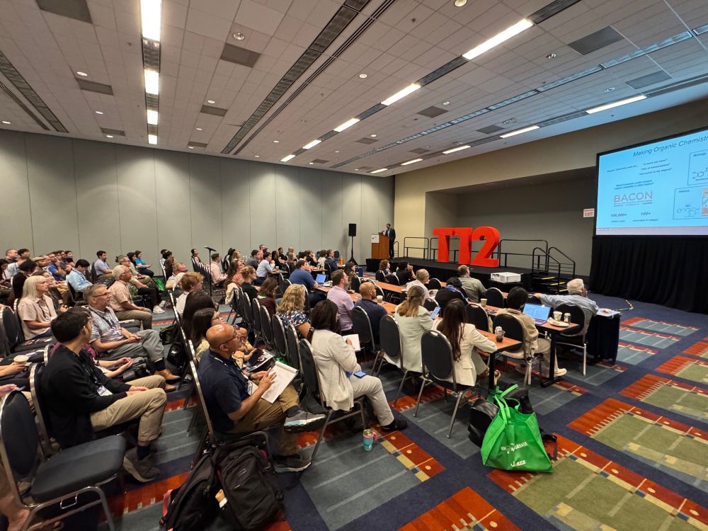 A conference room full of people 