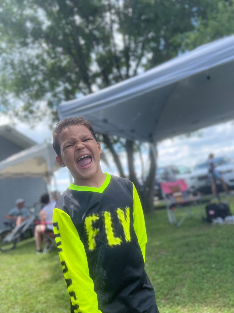 BMX racer excited smiling between races