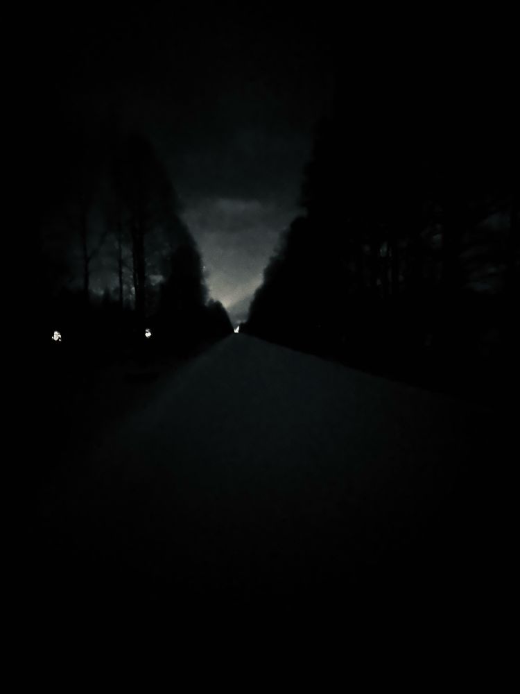 Black and White photo, straight road to distance at night, winter, Arctic Circle, Finland, Rovaniemi