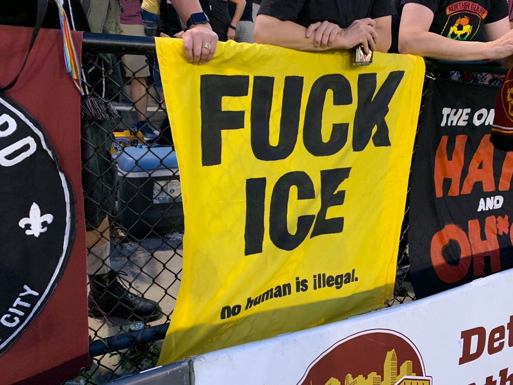 A yellow banner saying FUCK ICE with No Human is illegal underneath 