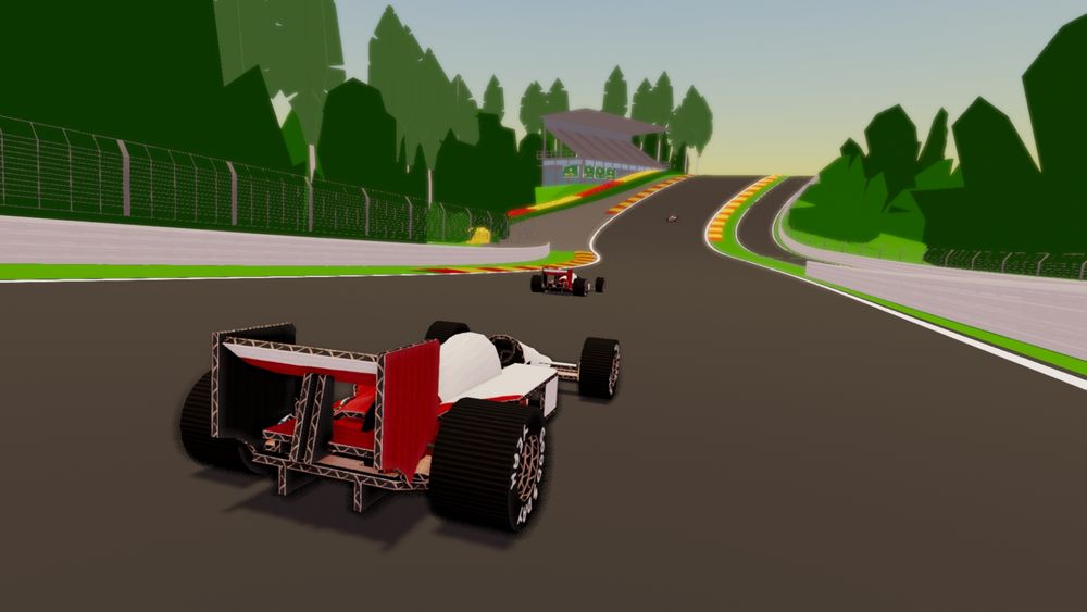 A white & red open wheel car made out of cardboard is visible from behind, heading towards the famous curve "Eau Rouge" from the "Spa" track in Belgium. The track itself is built out of cardstock. A grandstand is visible in the background.